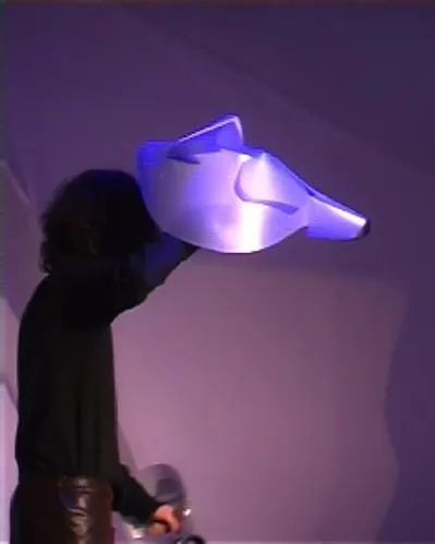A person holding a light up head Description automatically generated