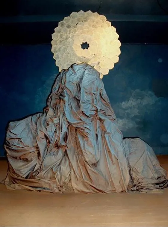 A large white circle on top of a mountain Description automatically generated